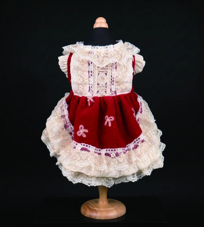 Catalog photograph of burgundy & ivory dress