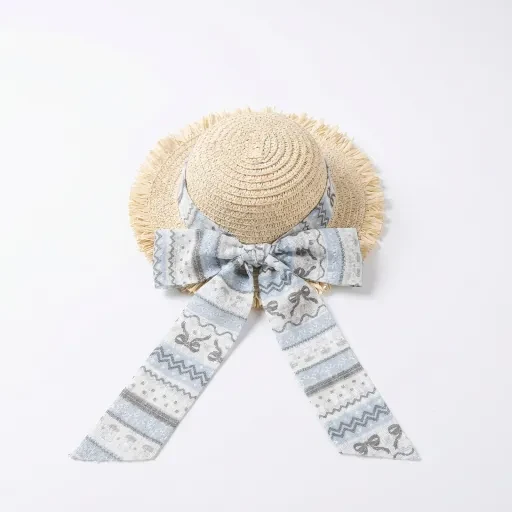 Pale hat with a blue patterned ribbon