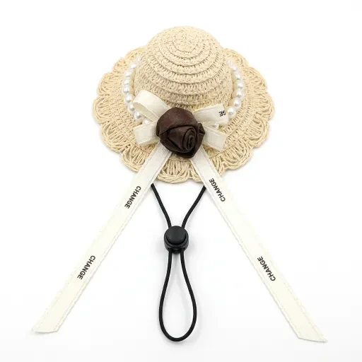 Pale hat with a light ribbon and brown rose decoration